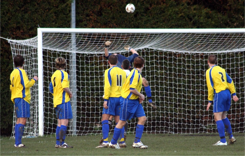 Greg Nessling tips this free kick over
