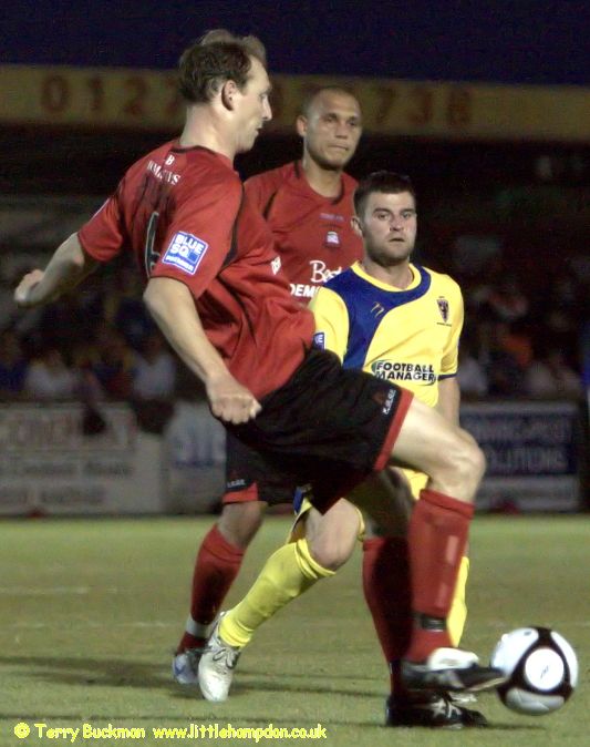 Richard Butler (9) takes a fall as Hendon keeper grabs the ball
