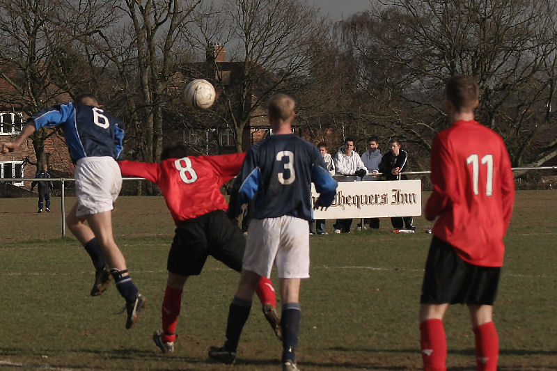 Danny Baker (6) beats Stuart Bennett (8) to the header watched by Ian Meek (3) and Danny Curd (11)
