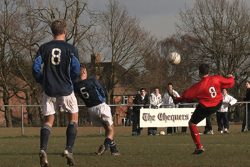 An acrobatic attempt by Stuart Bennett (8) with Dean Chamberlain (8) and Danny Baker (6) nearby
