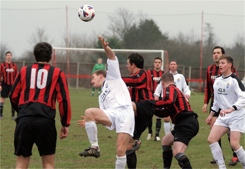 Marc Cooper wins this header from Sheldon Snashall (?)
