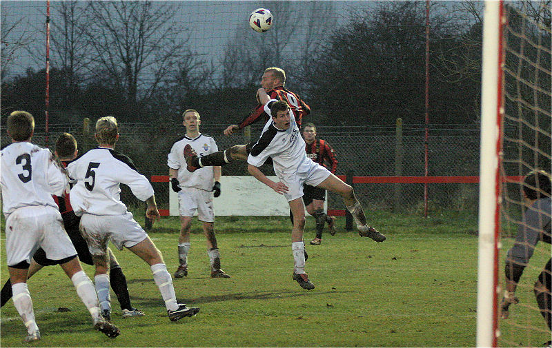 Kane Evans gets above the Eastbourne Utd defence
