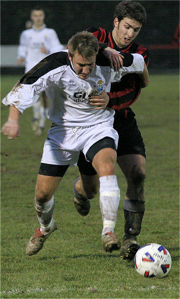 Max Dyer (?) is tackled by Tom Manton
