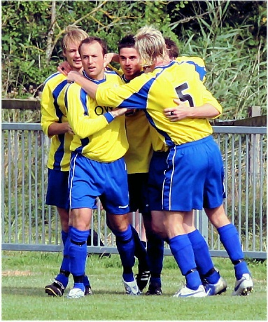 Liam Baitup scores and Eastbourne Town celebrate
