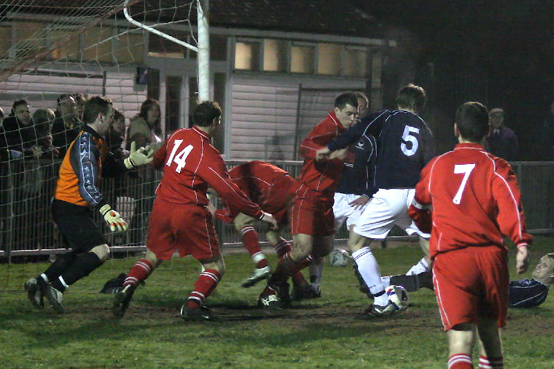 Sean Brownall (5) turns and strikes the ball...
