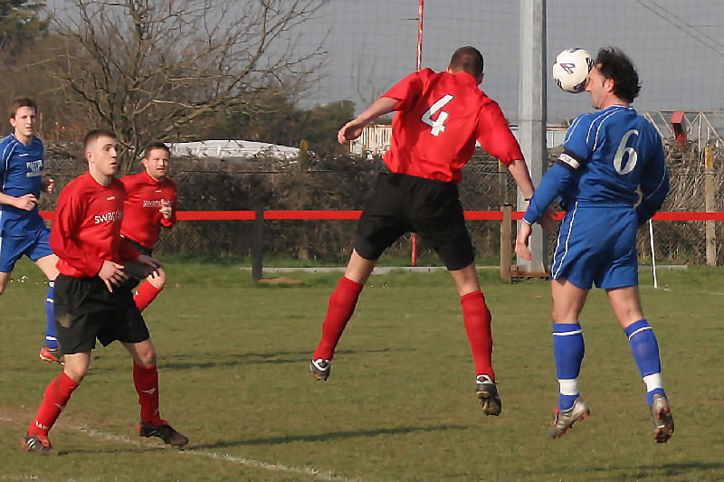 Chris Morrow (4) and Marcus Cooke (6) go for a header

