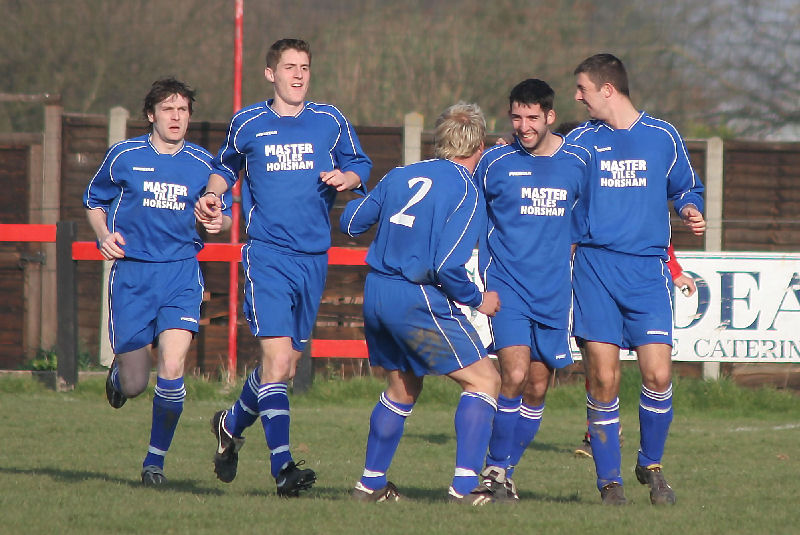 Broadbridge Heath players celebrate Tommy Di Martino's equaliser
