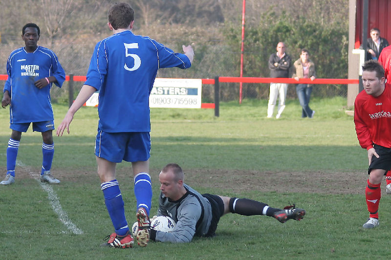 James McGrath grabs the ball at the feet of Scott Avory (5)
