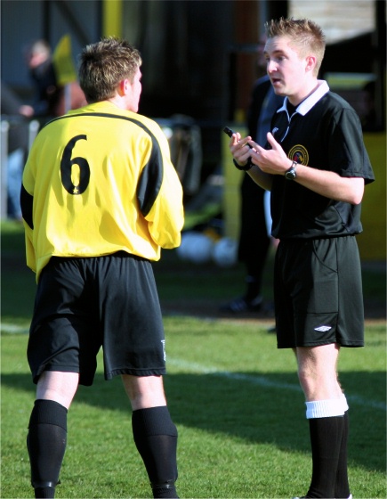 Ref Danny Austin has a word with Ollie Rowland
