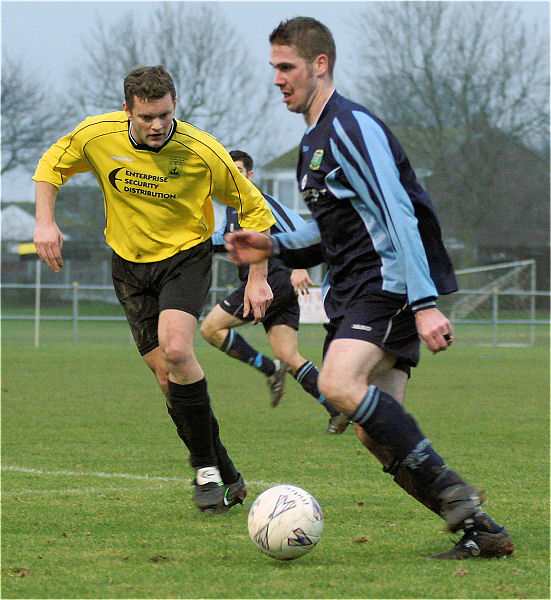 Gavin Jones is closely watched by Barry Pidgeon

