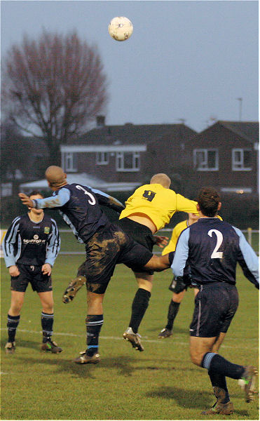 Clay Lamont and Steve Davies go for a header
