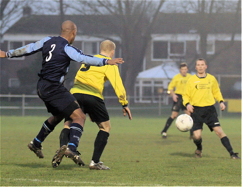 Steve Davies is closely marked by Clay Lamont
