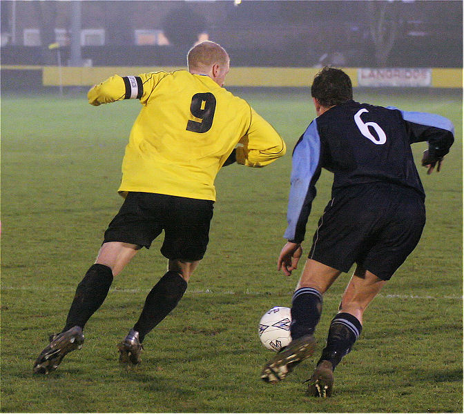 Steve Davies (9) goes past Gary Stacey (6)
