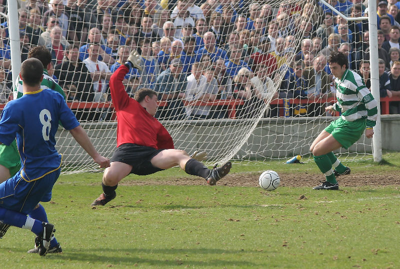 Stuart Baverstock is beaten but the ball is cleared by Peter Maynard
