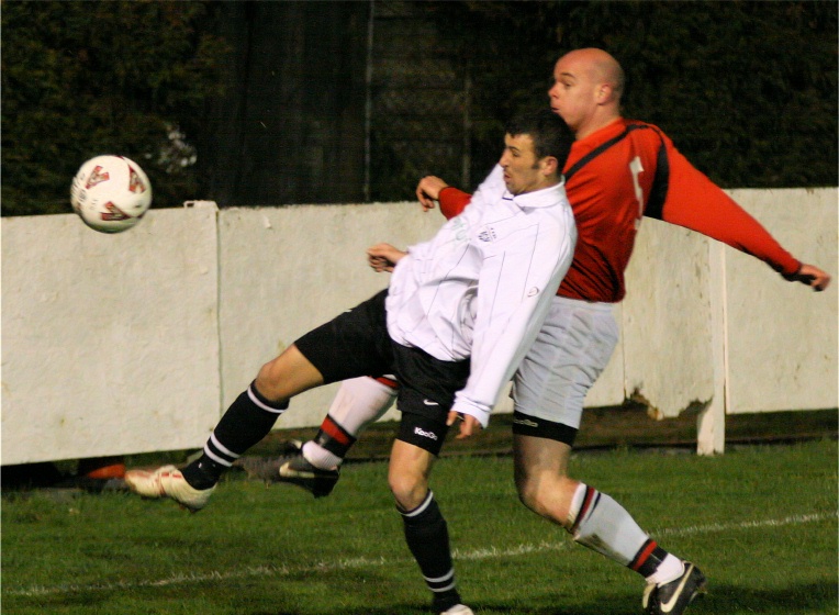 Tony Miles gets the ball away from Phil Churchill
