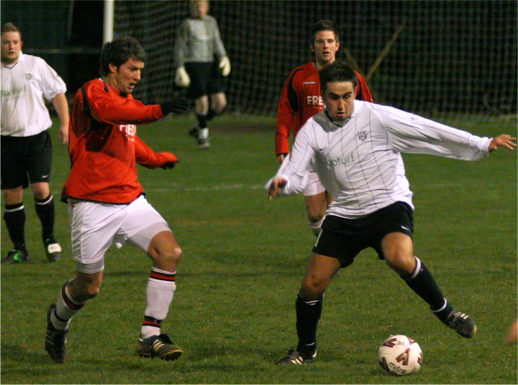 James Rhodes on the ball with Tom Manton coming in
