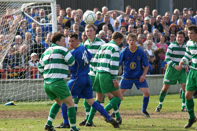 Shane Smeltz (10) is beaten to the ball by Micky Regan (2) and Kevin Burgess (6)
