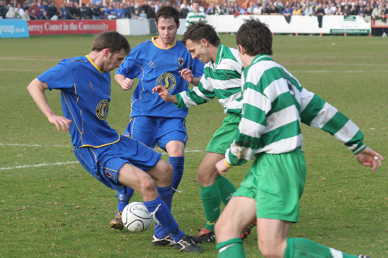 Dons Anthony Howard and Rob Ursell are challenged  by Dorkings Peter Maynard and ex Don Dave Towse
