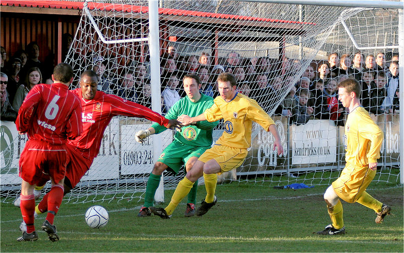 Richard Pacquette tries to find a way through the Dons defence
