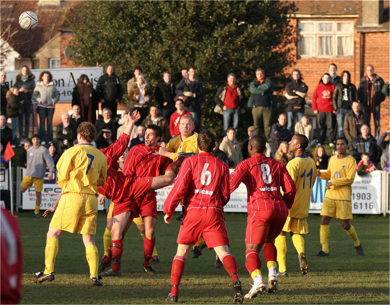 Worthing's Ben Andrews gets a header
