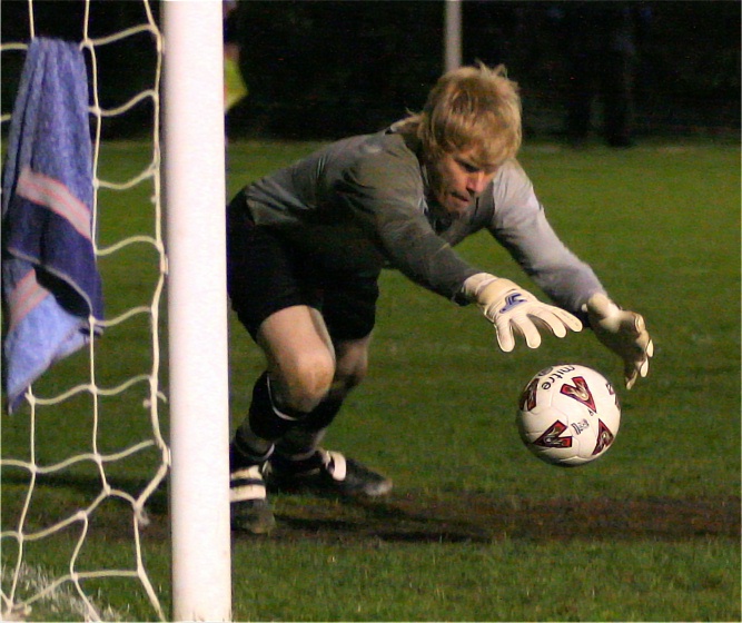 Ex Wick keeper Tom Rand grabs this Wick free kick
