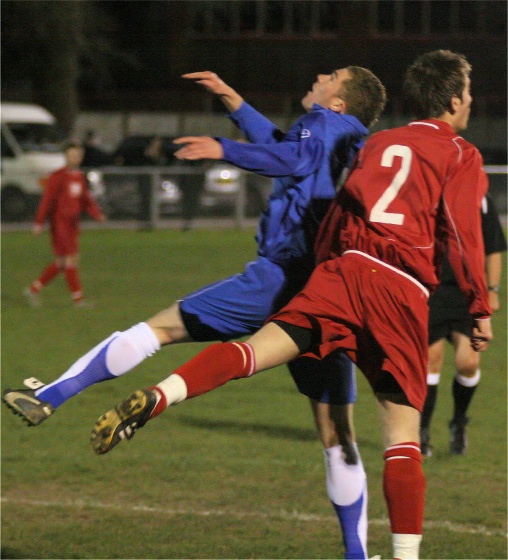 Andy Smart and Scott Edwards go for a header
