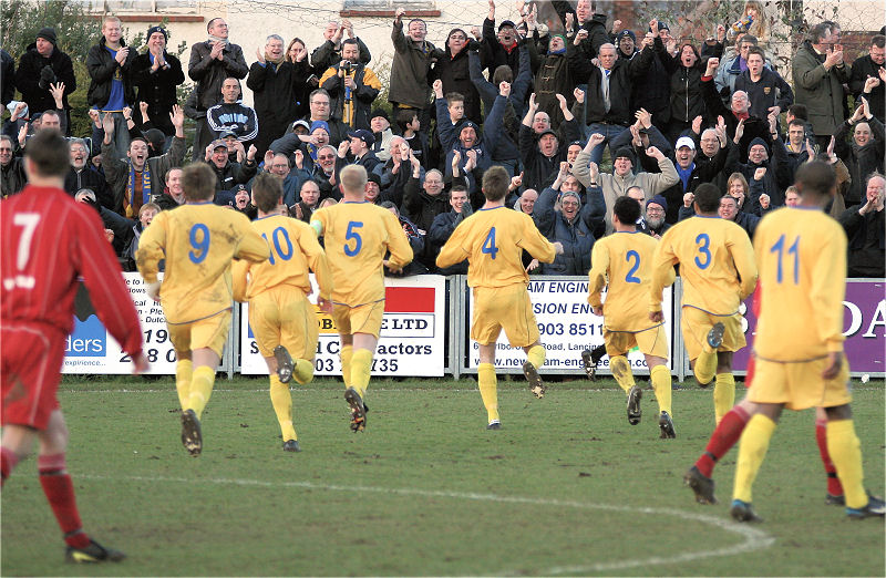 Antony Howard (4) opens the scoring for the Dons and leads the celebrations
