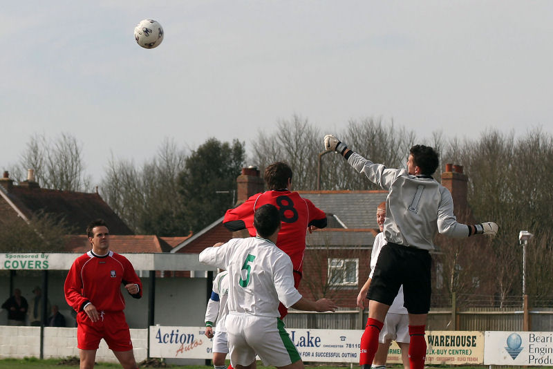 Chi keeper Barry Squires and Scott Tipper combine to beat Stuart Faith (8) with John Price (5) close by
