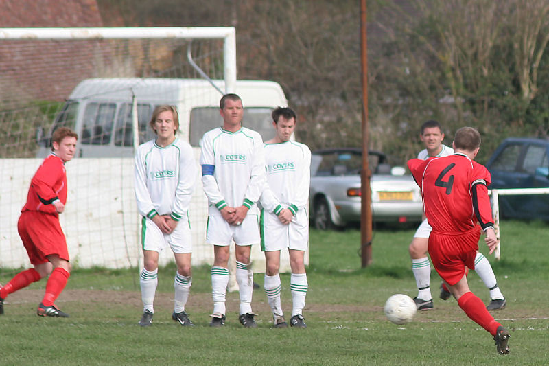 Chris Hewitt takes a free kick and the wall does a good job
