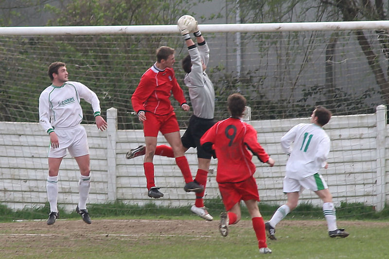 Barry Squires cuts out the cross
