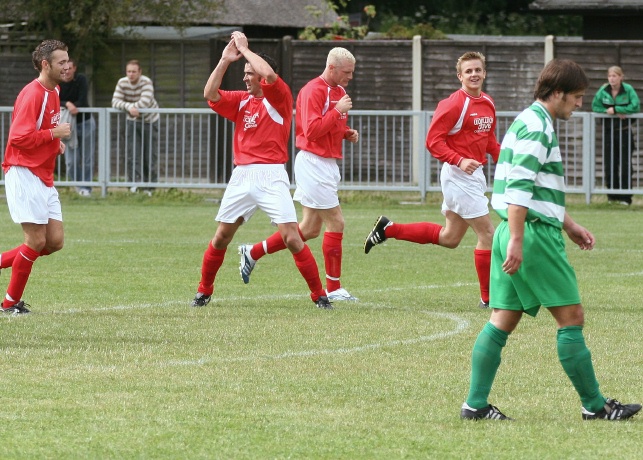 Arundel celebrate their second goal scored by Duncan Barnes
