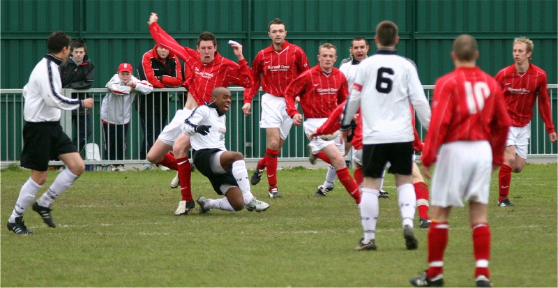 Marcel Dennis is fouled in the area ...
