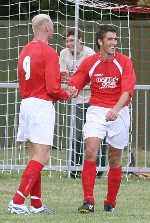 ... and is congratulated by Kane Evans
