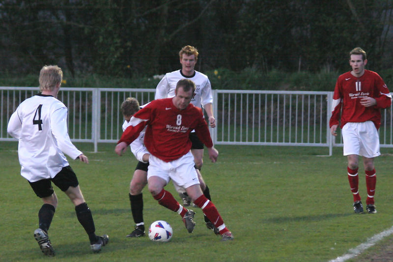 Rob Grove is tackled by Lee Cox with Kieran Mercer (4) looking to get in
