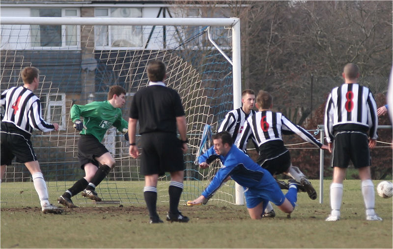Brett Neal hits the deck in this goalmouth scramble
