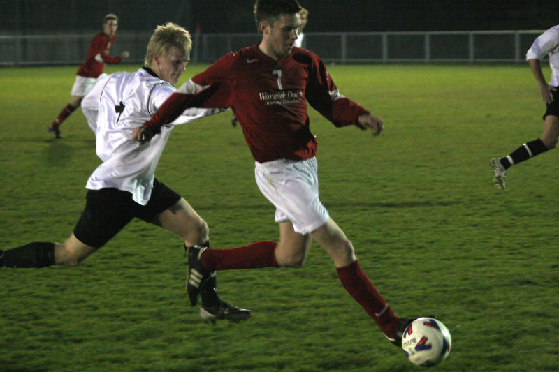 Lewis Blake is chased by Kieran Mercer
