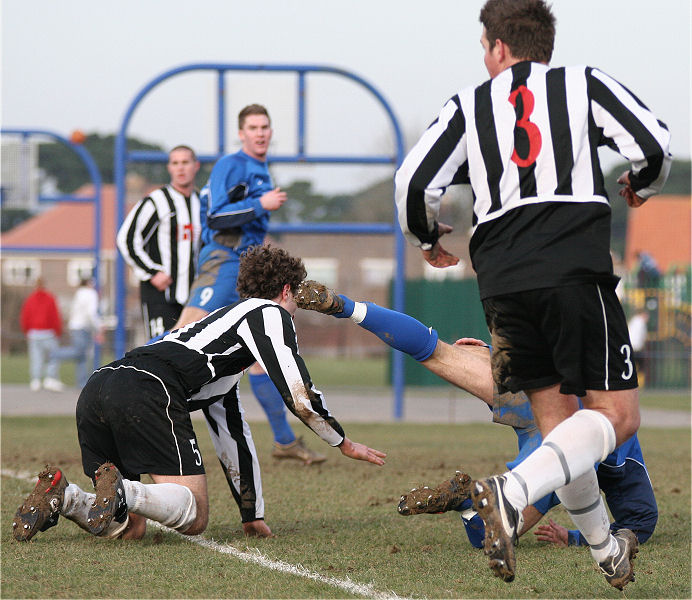 Adam Bibb (?) is brought down on the edge of the box and Tom Rider nearly collects a boot in the face
