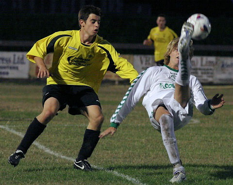 Scott Hounslow gets an acrobatic cross in
