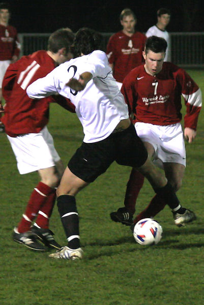 Liam O'Brien (3) tries to deal with Andy Boxall (11) and Lewis Blake (7)
