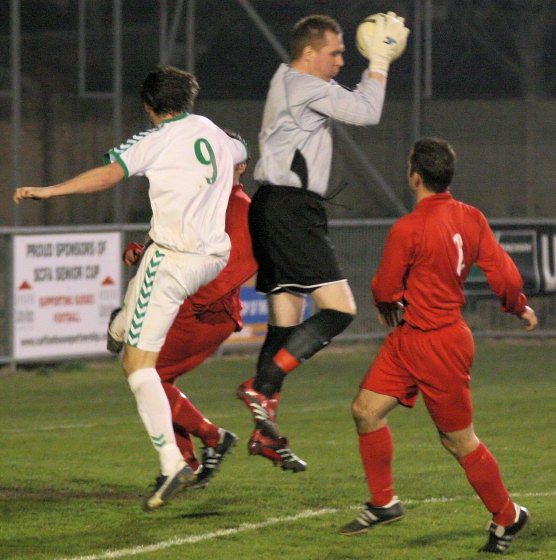 Ross Standen beats Steve Boston to the ball
