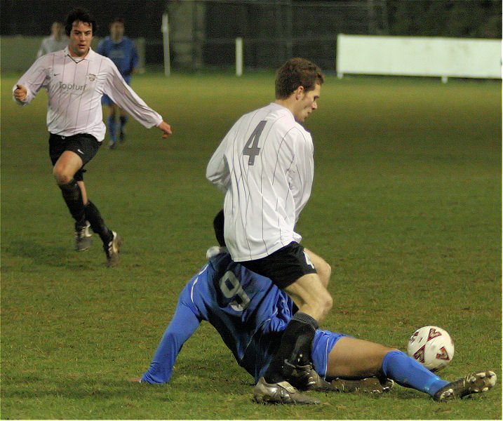 Shaheen Sadough gets the ball away from Chris Yelling
