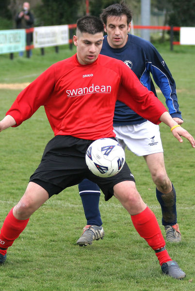 Hassan Yassan shields the ball from Darren Clifton
