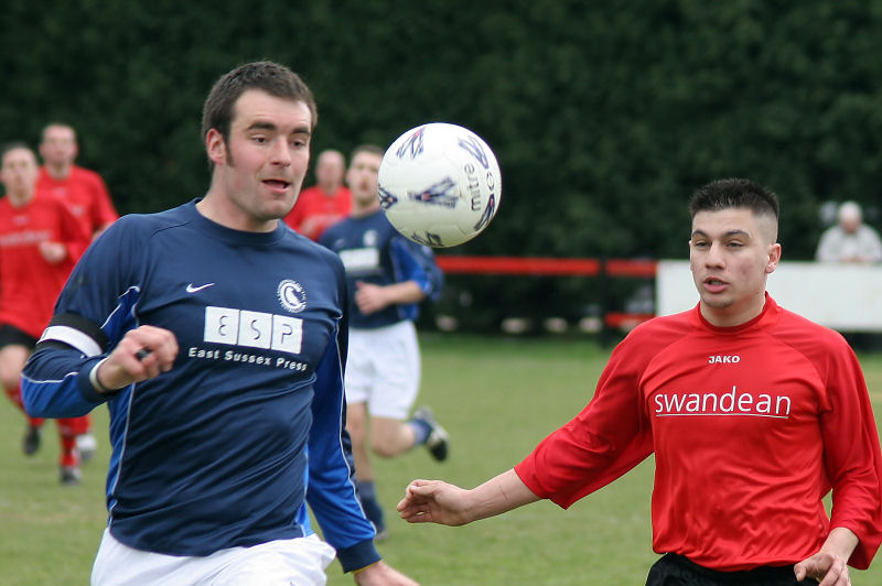 The ball drops between Craig Bishop and Hassan Yassan 
