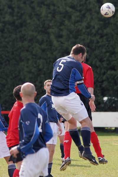 Craig Bishop wins the header from Chris Morrow 
