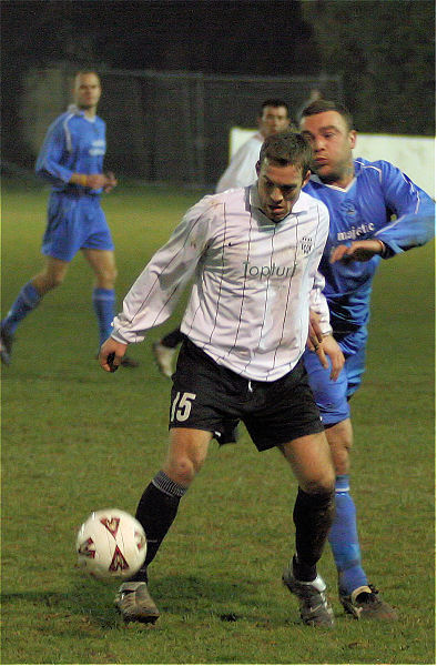 Ryan Hudson on the ball with Danny Smith close by
