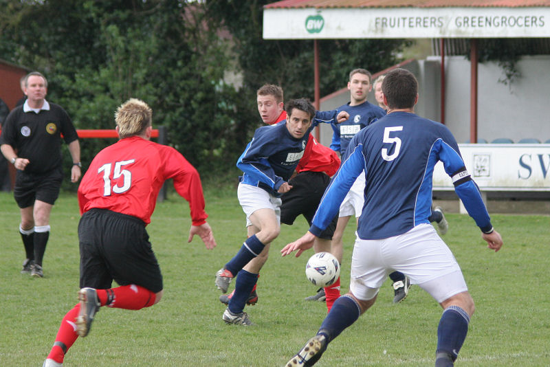 Competing for the ball are Jan Miller (15), Darren Clifton, Danny Curd and Craig Bishop (5)
