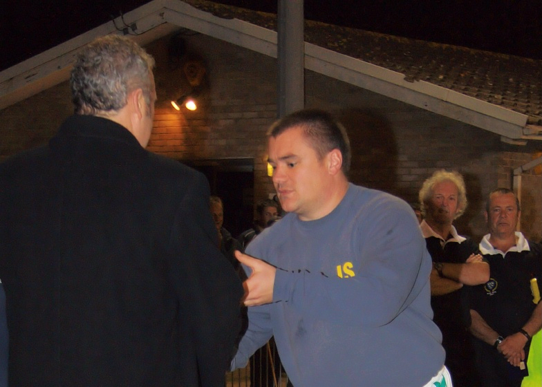 Assistant manager Ian Saunders picks up his award
