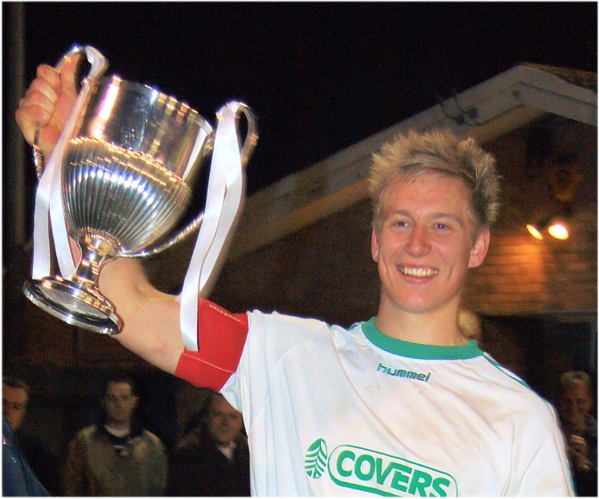 Alex Ward shows off the trophy
