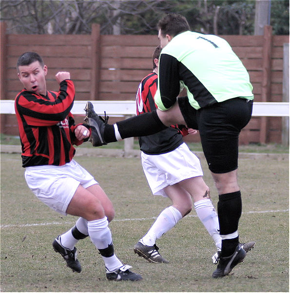 James Leahy clears the danger from Zak Newman and Nick Flint
