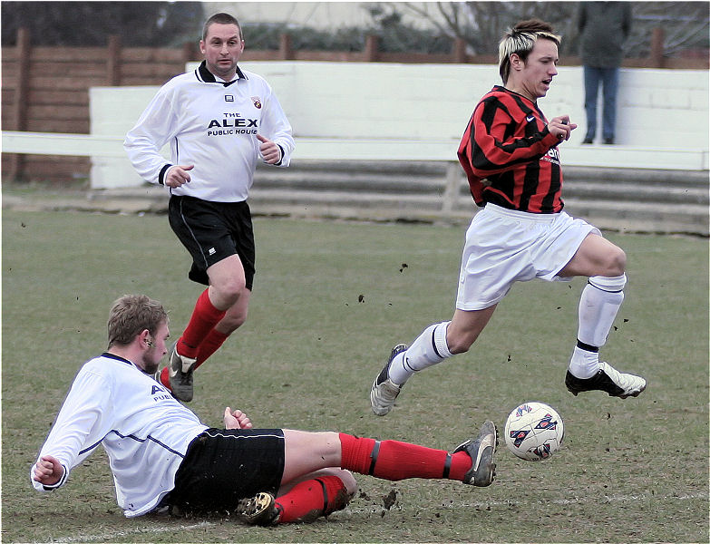 James Heller wins the ball from Pat Dunning
